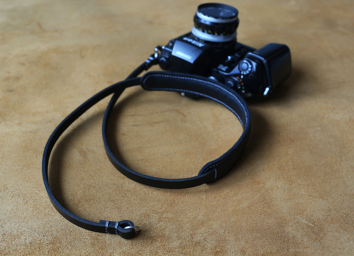 Premium leather camera strap with minimalist aesthetic