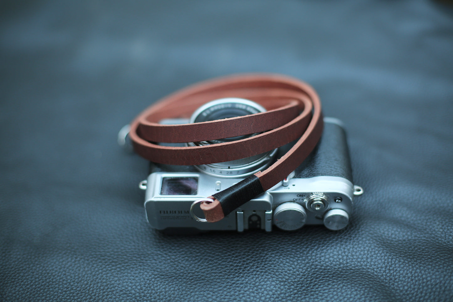 Vegetable tanned brown strap paired with silver camera