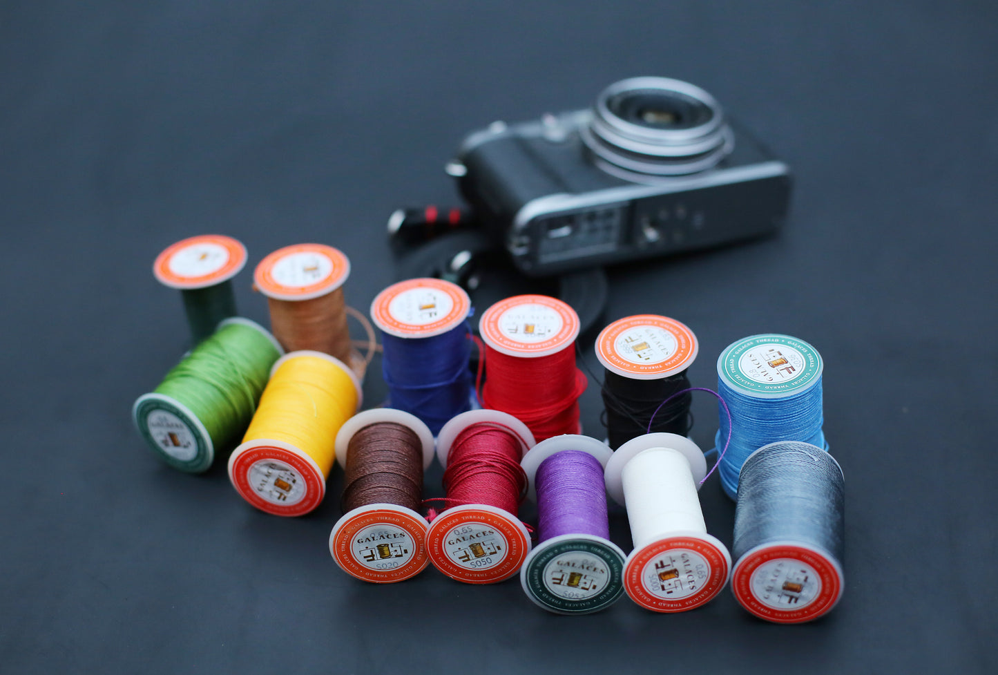 Handmade black buffalo leather camera strap, 10mm wide, minimalist design for mirrorless and film cameras