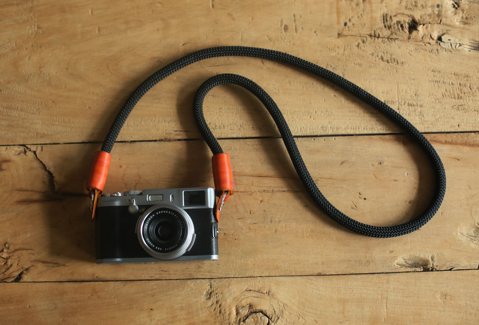 camera strap with hand-dyed vegetable-tanned leather ends