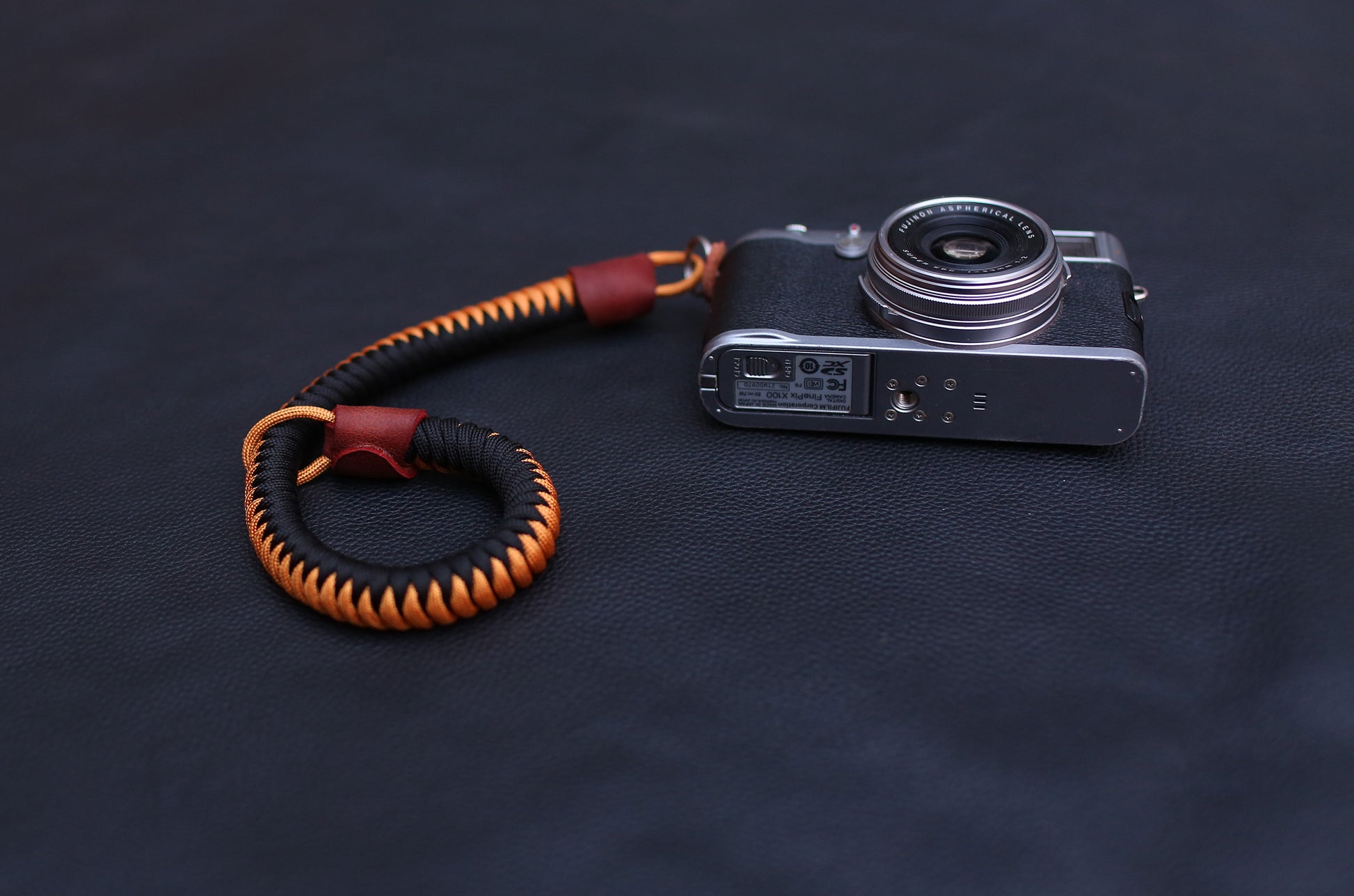 Detailed view of braided paracord texture in black and gold