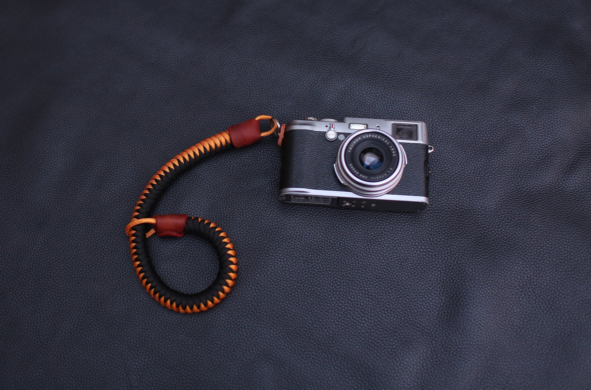 Windmup handmade paracord wrist strap mounted on mirrorless camera