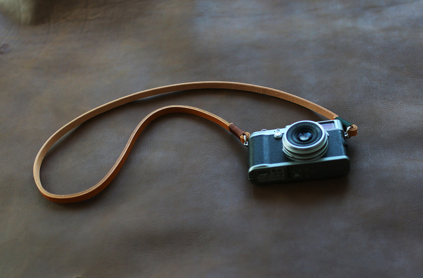 Model wearing handmade camera neck strap outdoors