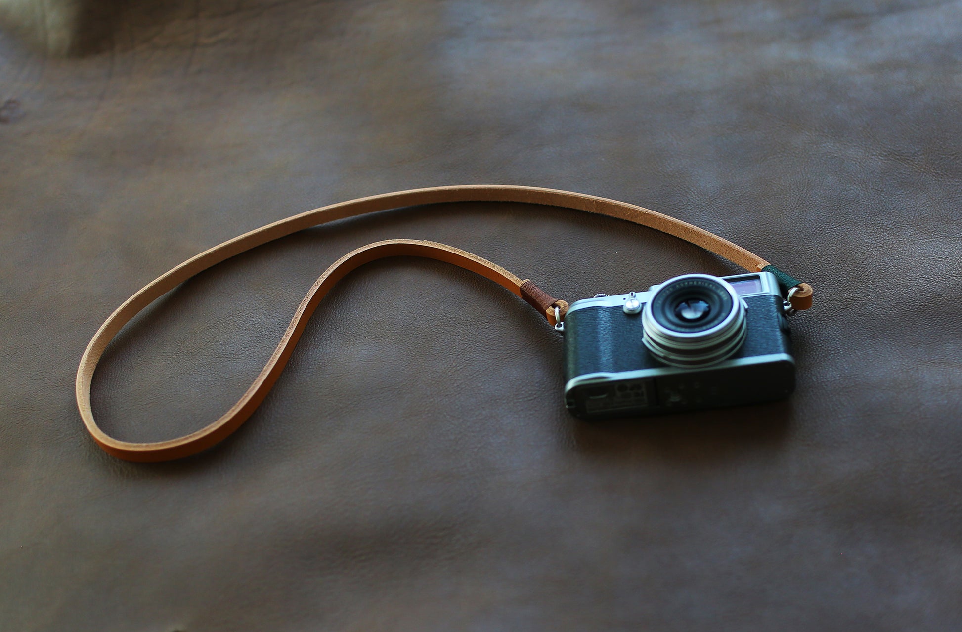 Model wearing handmade camera neck strap outdoors
