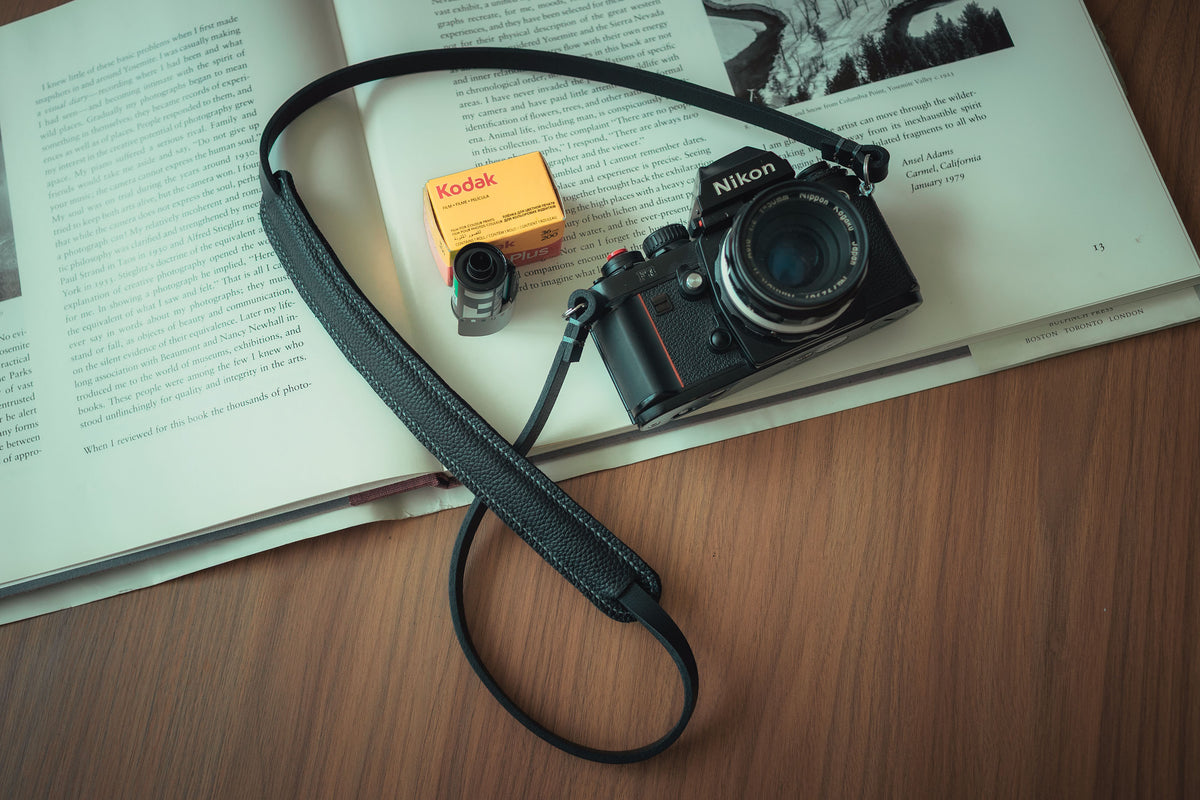 Comfortable black leather camera neck strap for long photography sessions