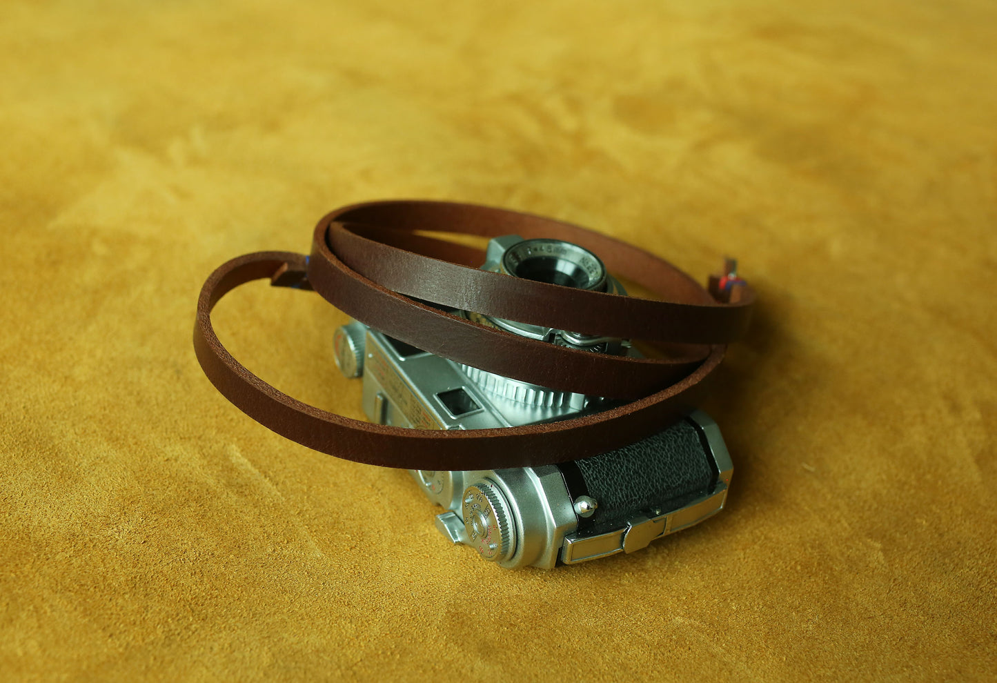 Bespoke leather camera carrier featuring artisanal craftsmanship
