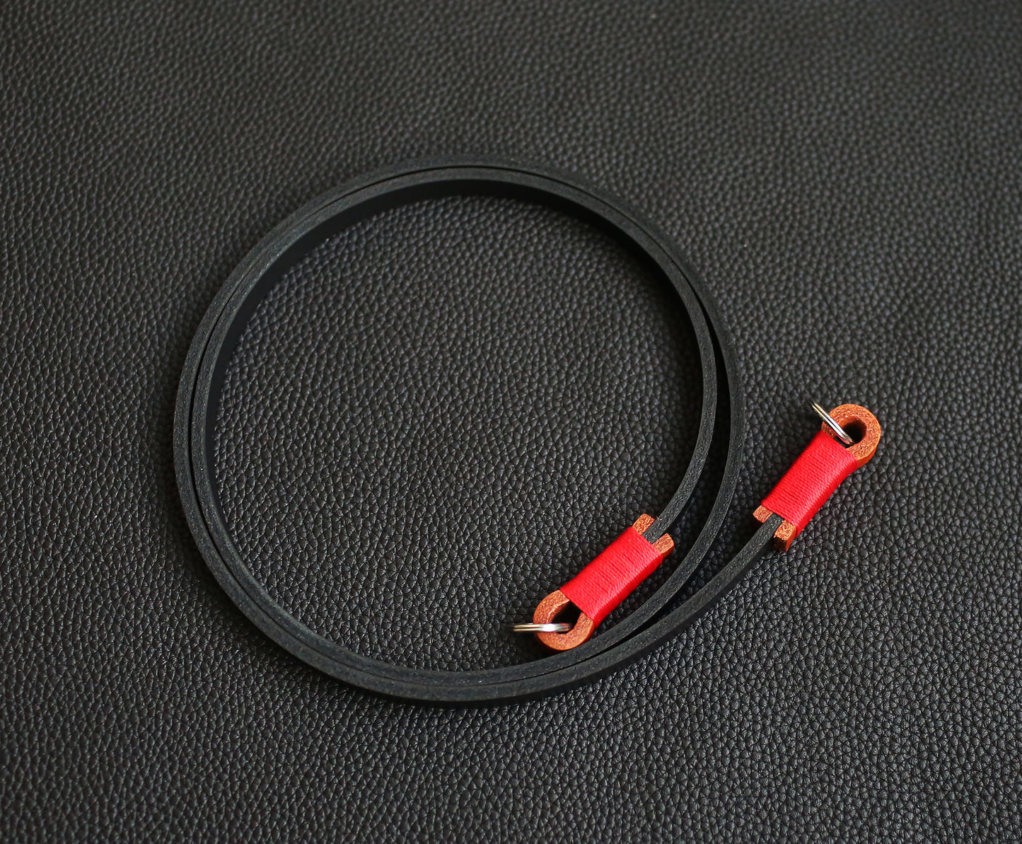 black and red handmade camera strap