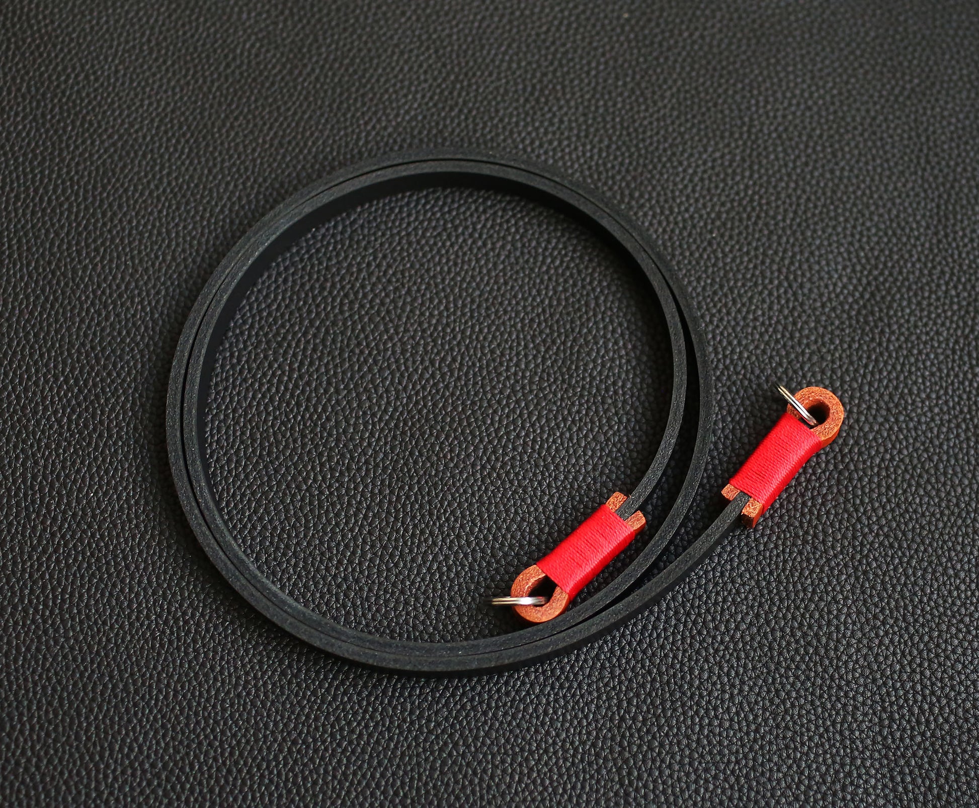 black and red handmade camera strap