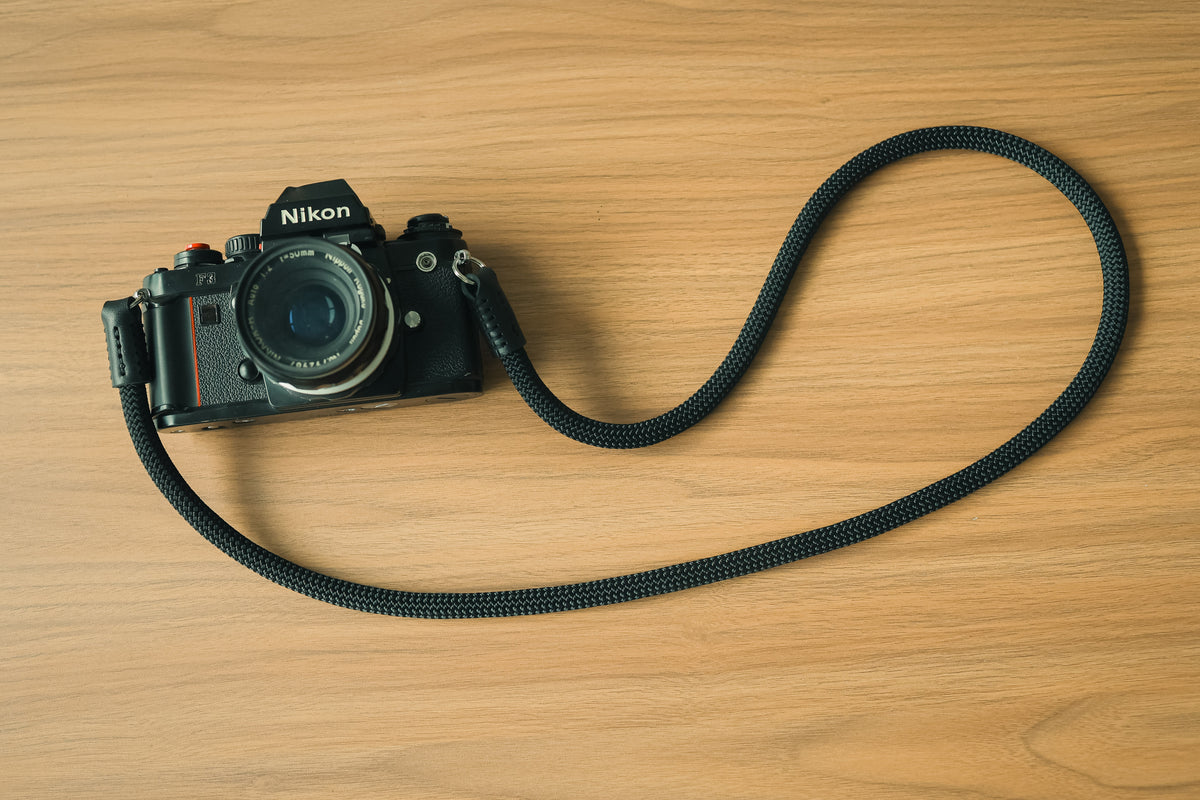 The Stealth black rope camera strap with a film camera