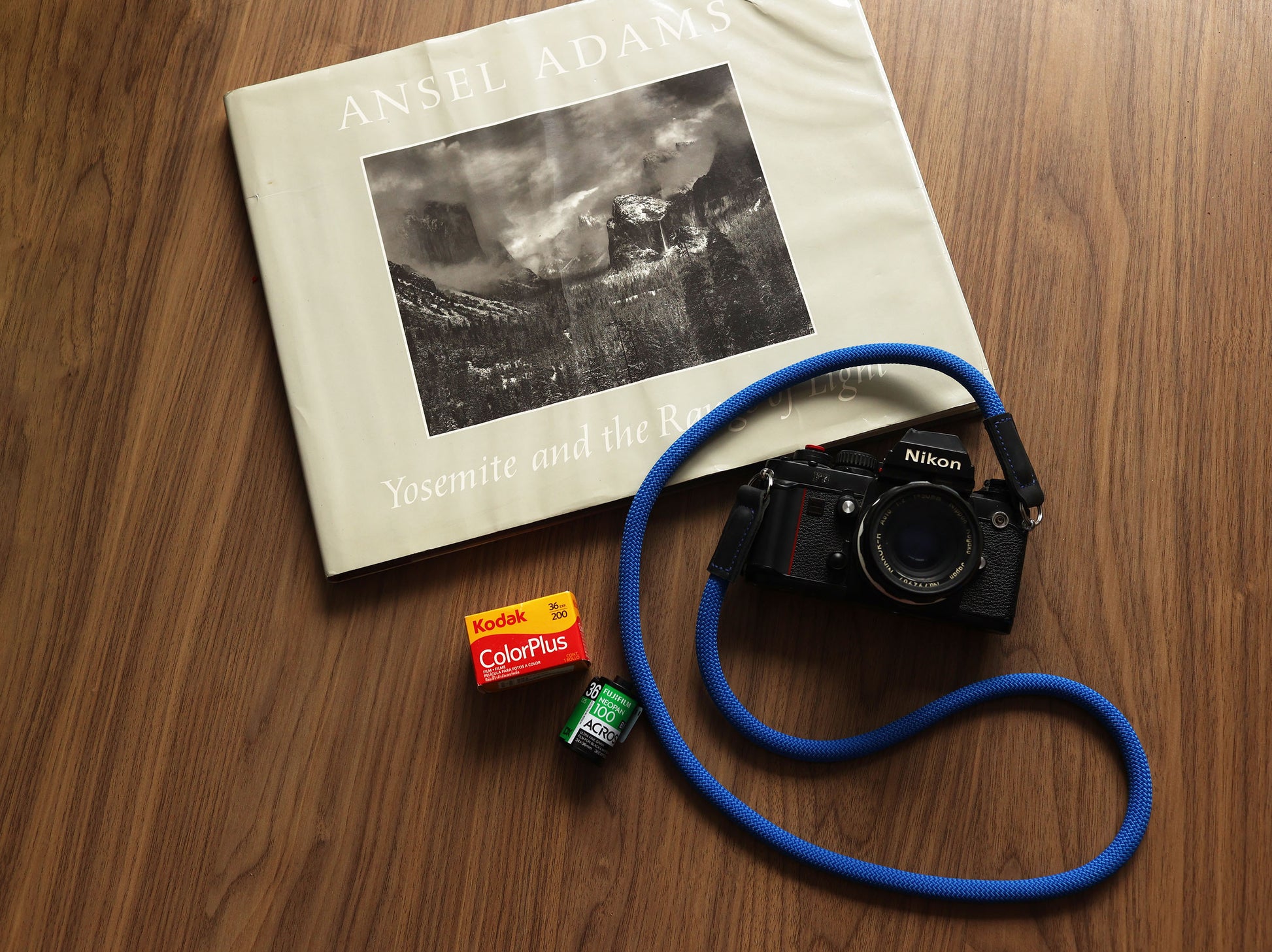 Blue camera strap styled for film photography enthusiasts