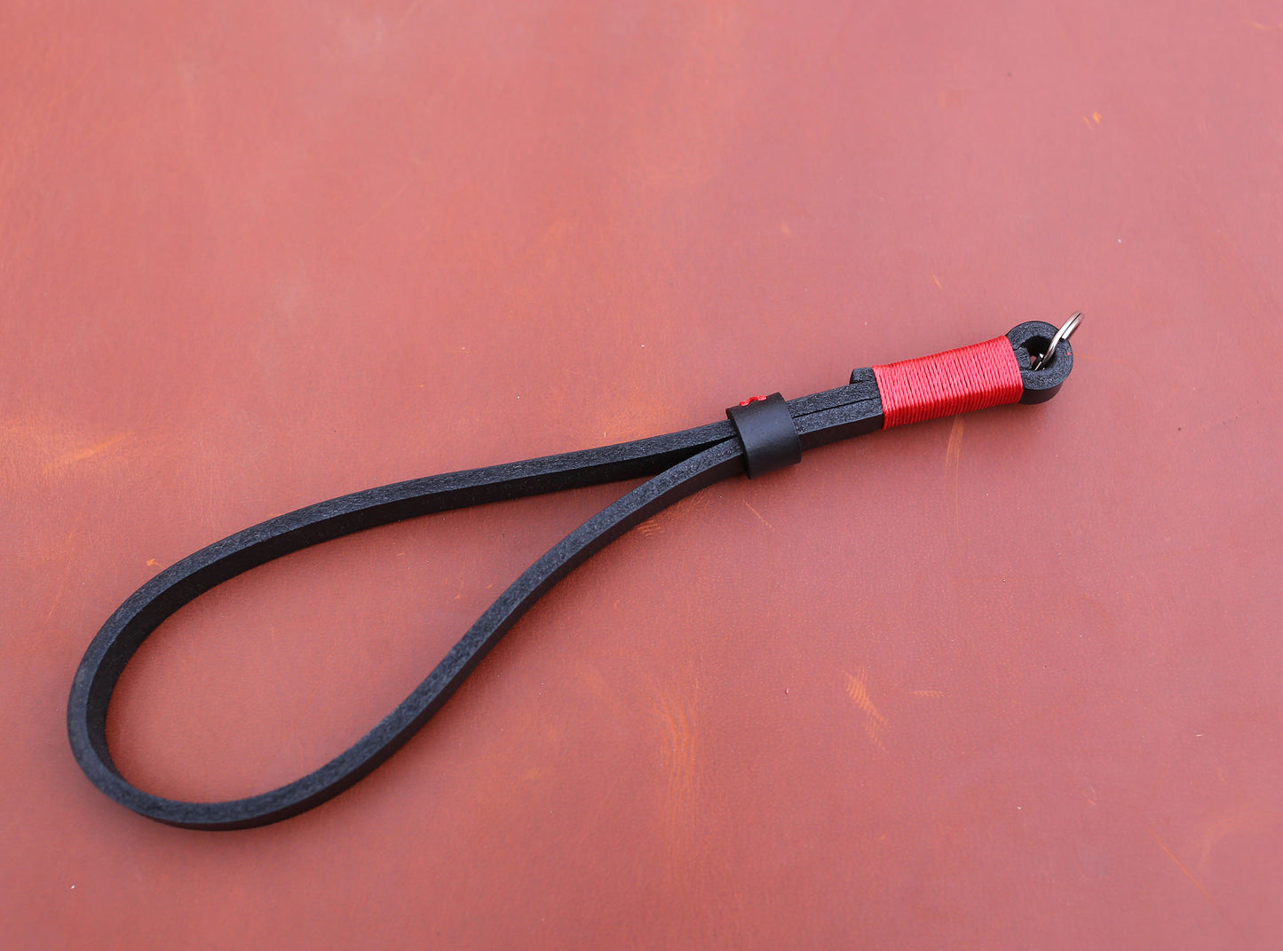 Genuine buffalo leather camera strap showing natural wrinkles and unique pores