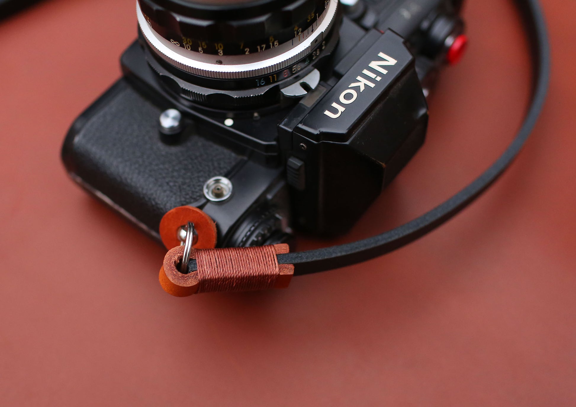 Vegetable-tanned camera strap ends with wax thread