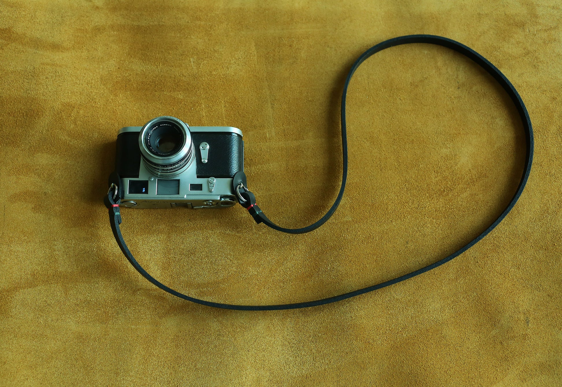 Durable genuine leather strap designed specifically for mirrorless camera systems, stealth black color