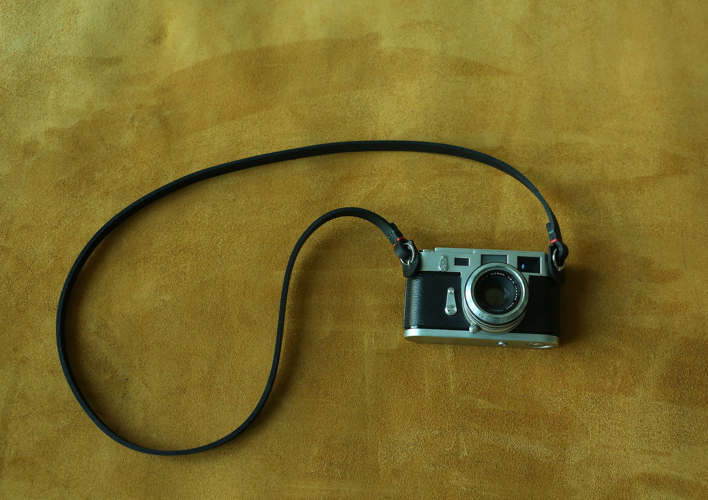 Handmade black leather camera neck strap crafted from thick genuine cowhide