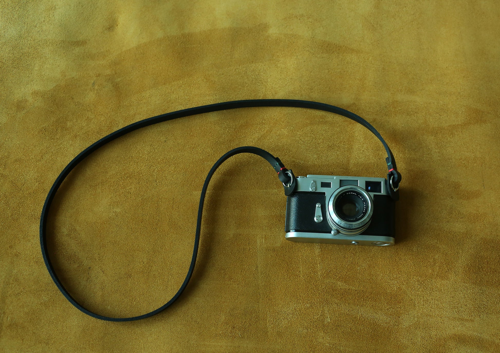 Handmade black leather camera neck strap crafted from thick genuine cowhide
