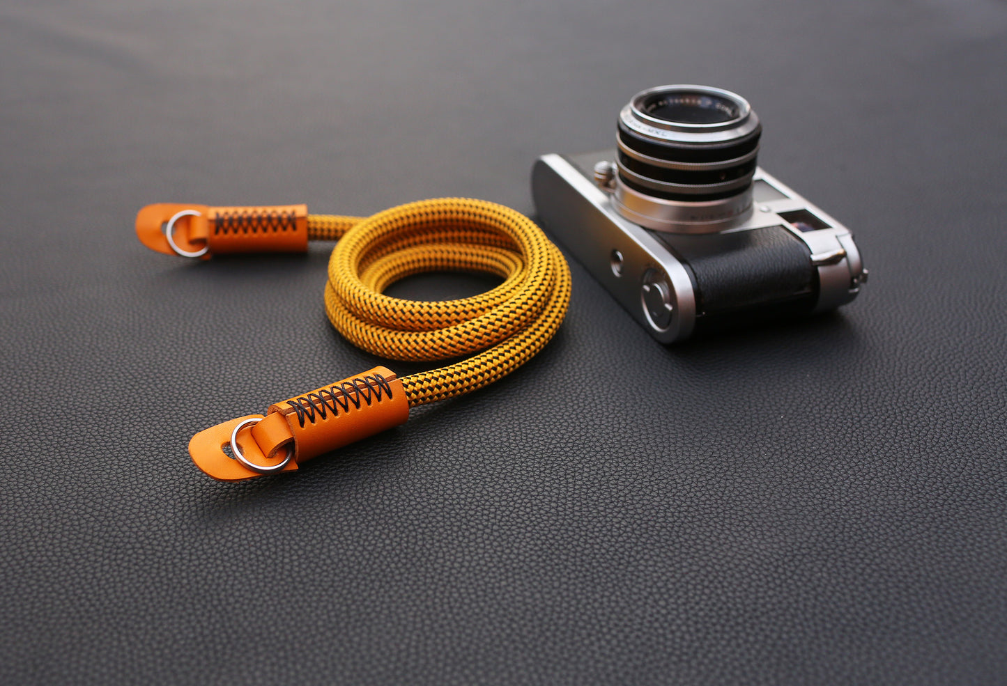 Lightweight gold rope camera strap with durable leather caps
