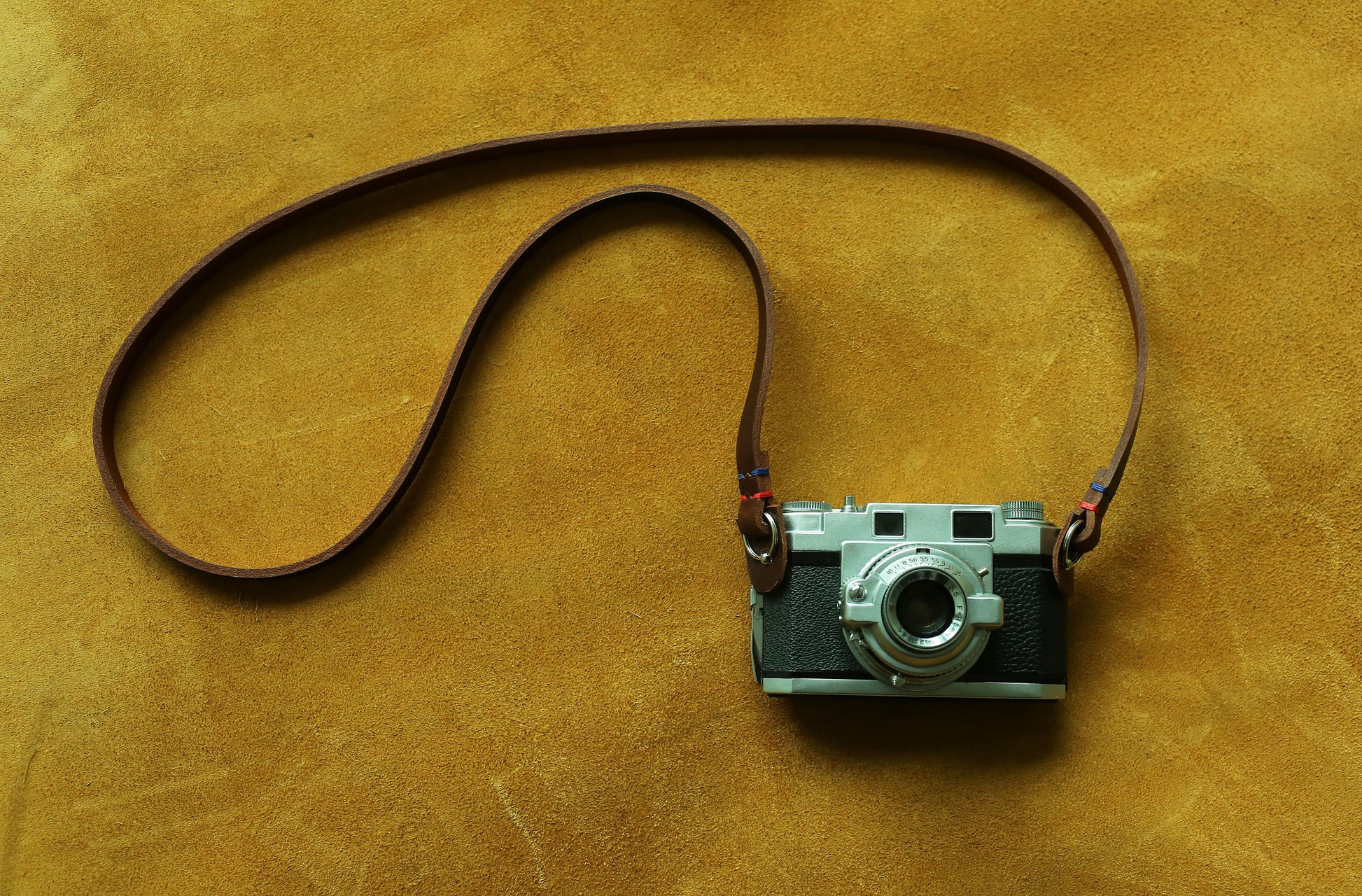 Minimalist leather neck strap designed for professional photographers