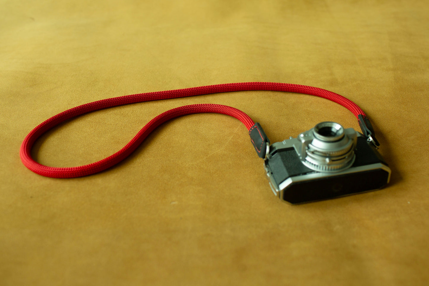 Secure red climbing rope strap for outdoor and street photography enthusiasts