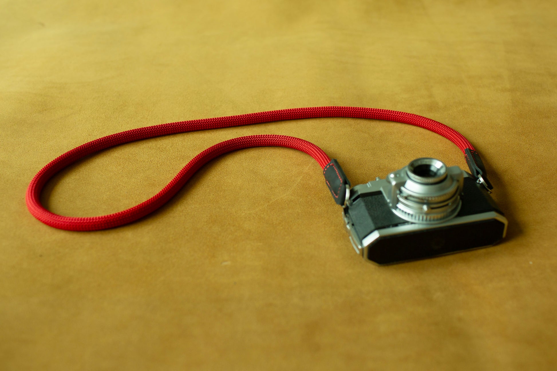 Secure red climbing rope strap for outdoor and street photography enthusiasts