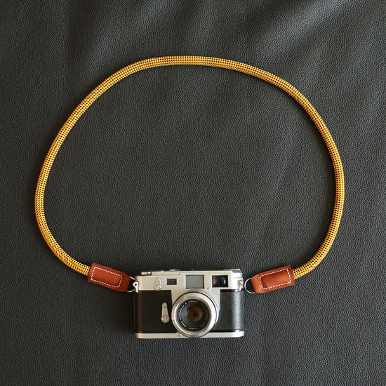 Windmup Gold and Brown edition camera strap paired with premium photography gear
