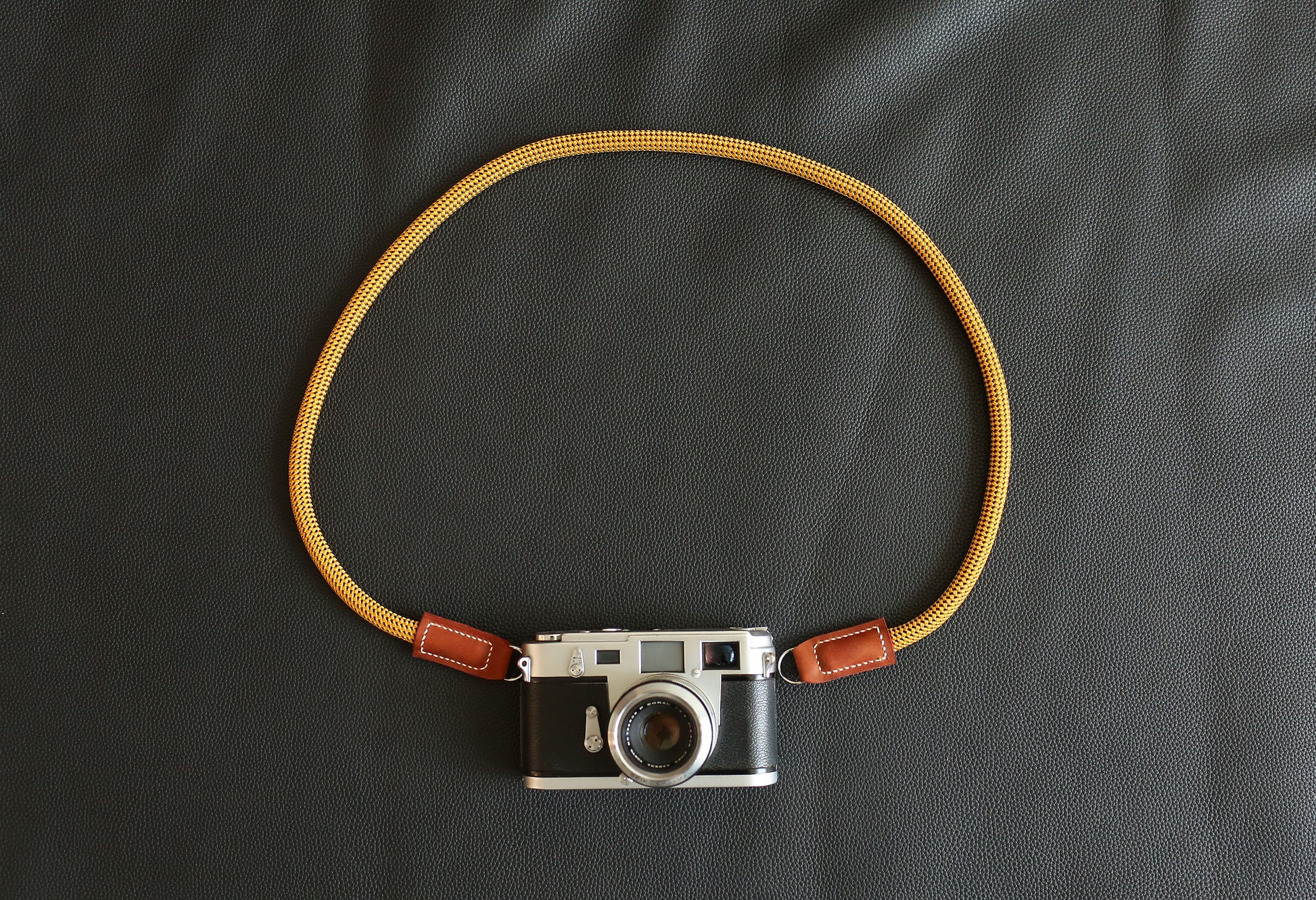 Windmup Gold and Brown edition camera strap paired with premium photography gear