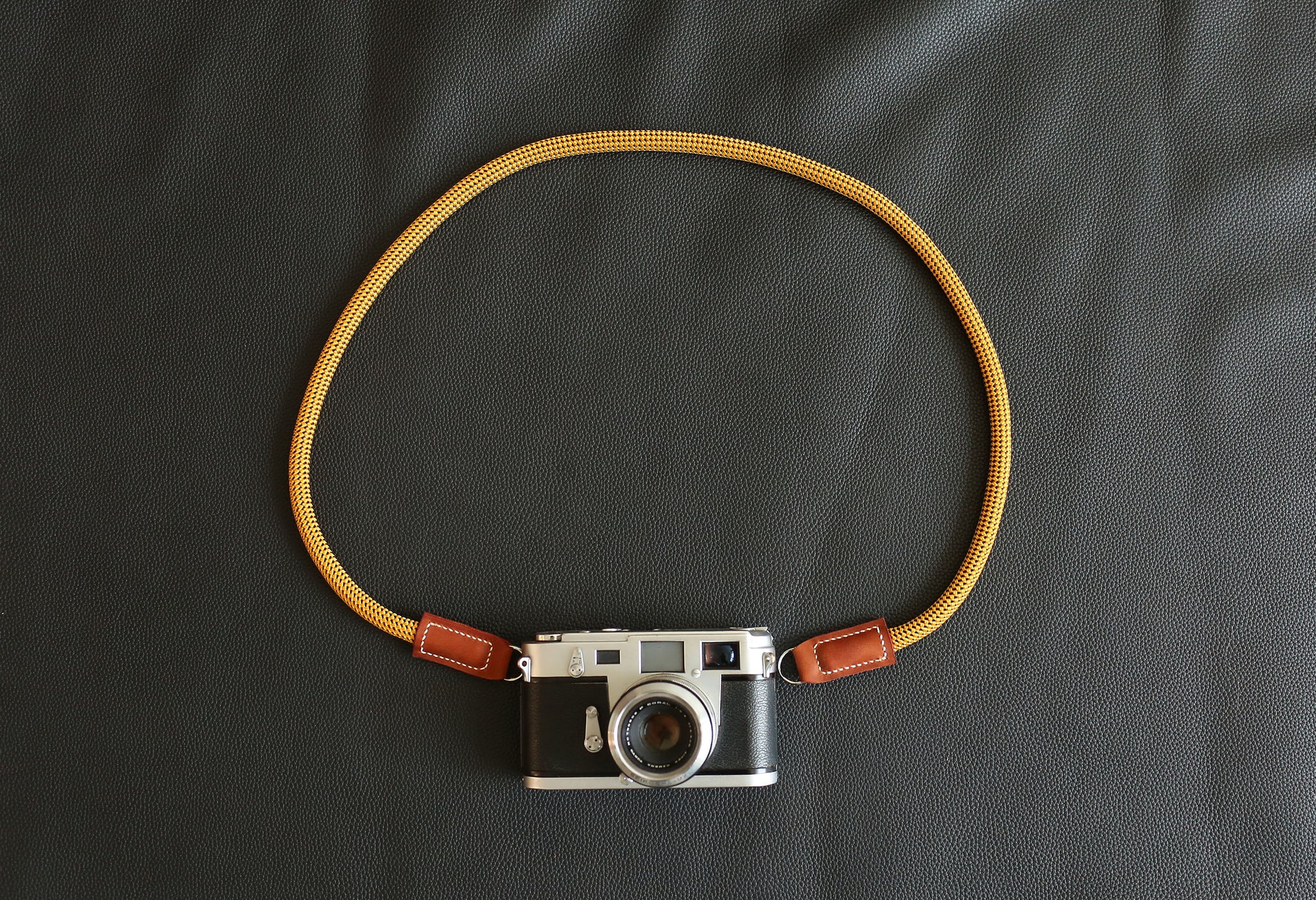 Windmup Gold and Brown edition camera strap paired with premium photography gear
