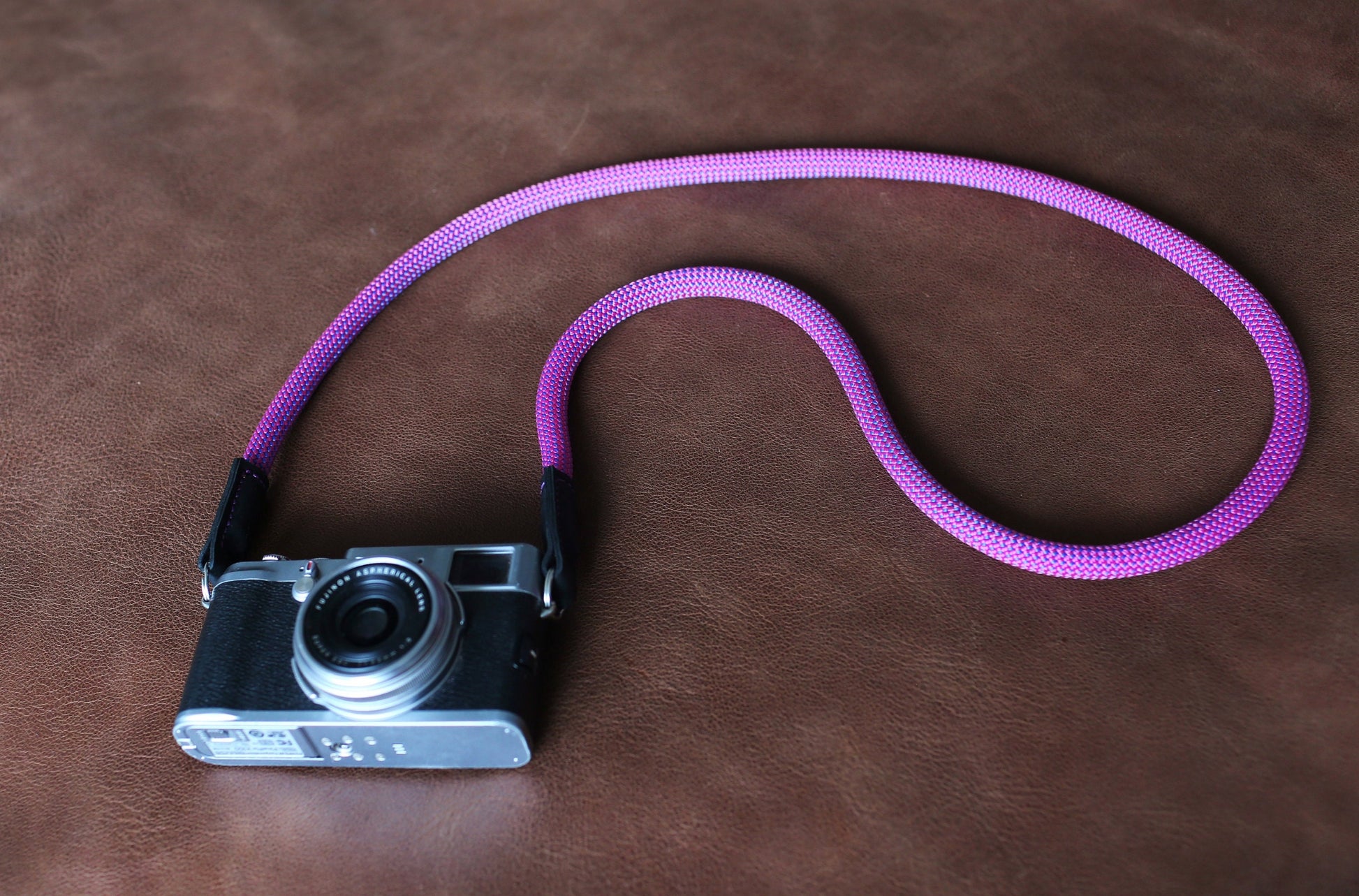 Purple climbing rope camera strap with black leather ends
