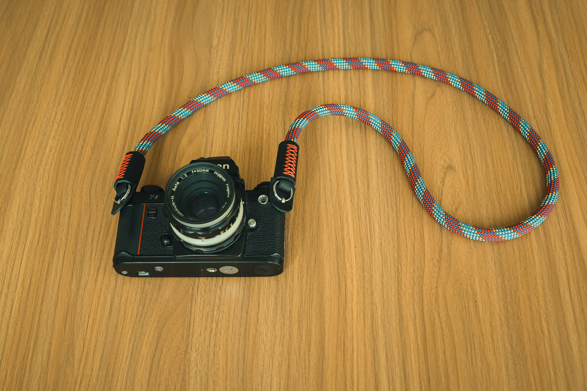 Red blue and white woven rope camera strap