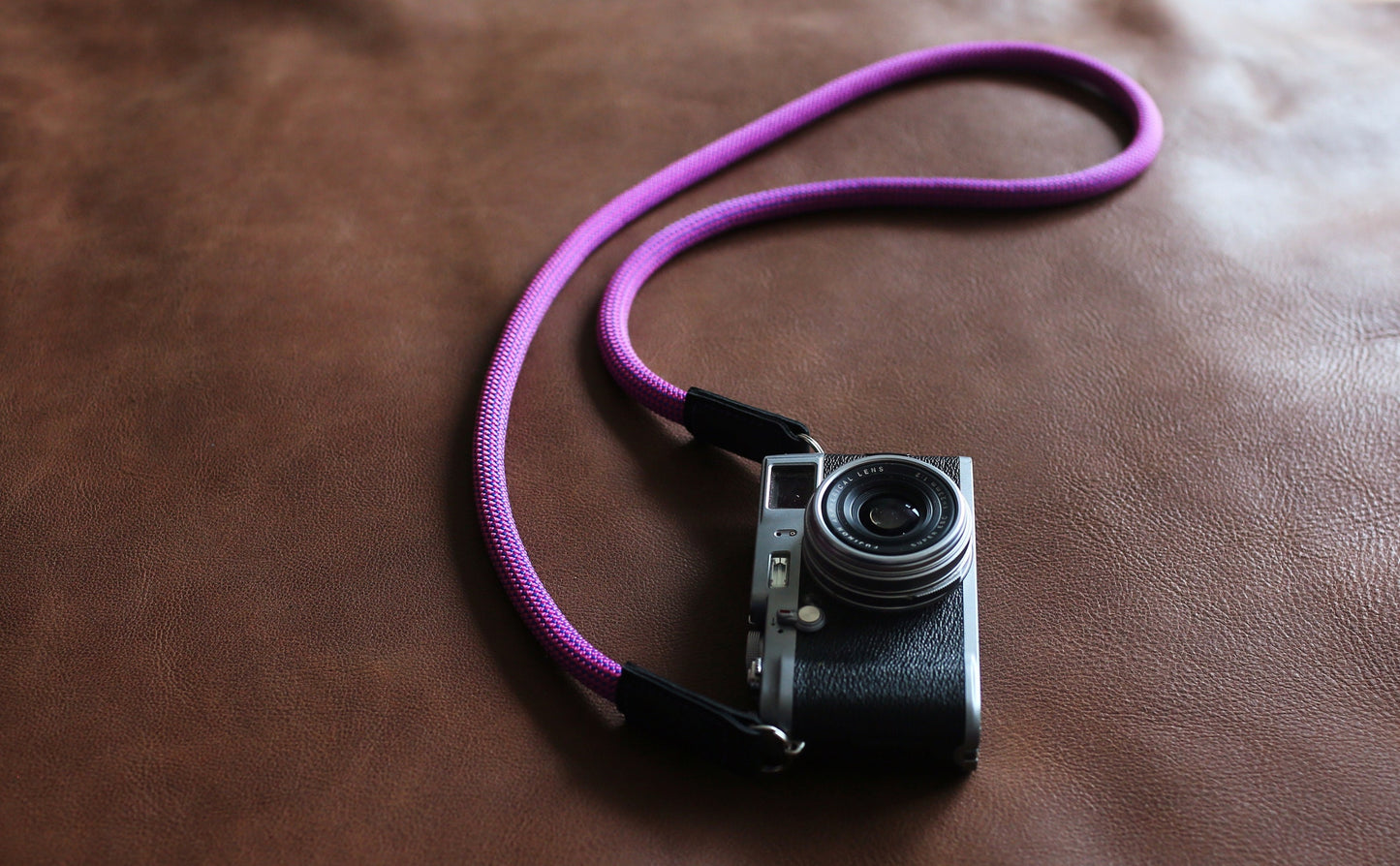 Black leather ends stitched on camera strap