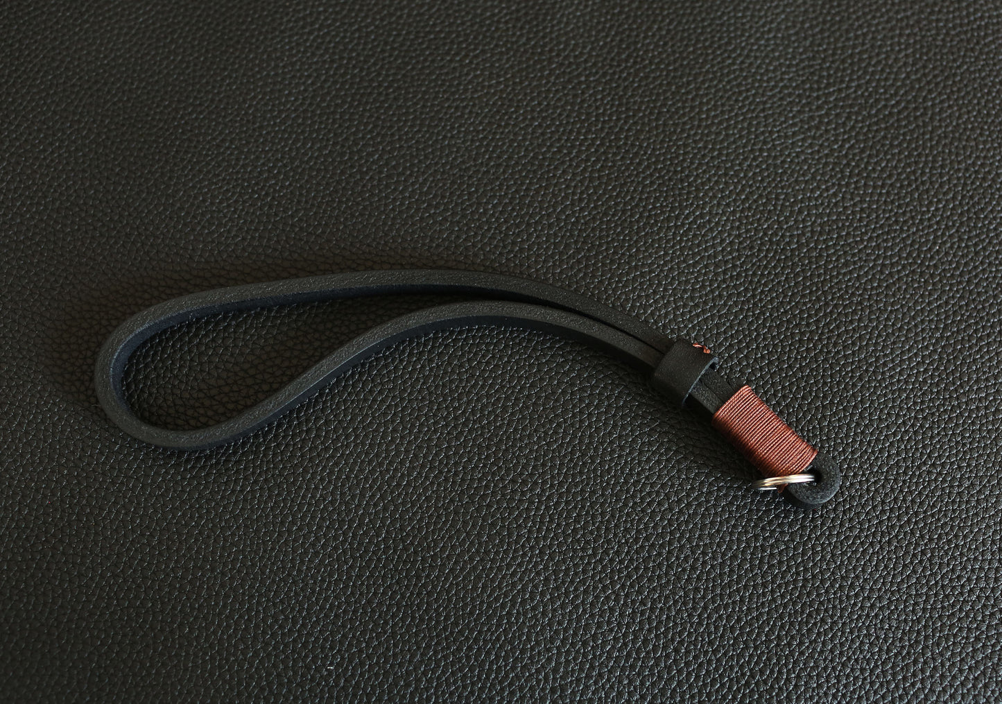 Rugged 11mm wide leather camera wrist loop providing superior gear support