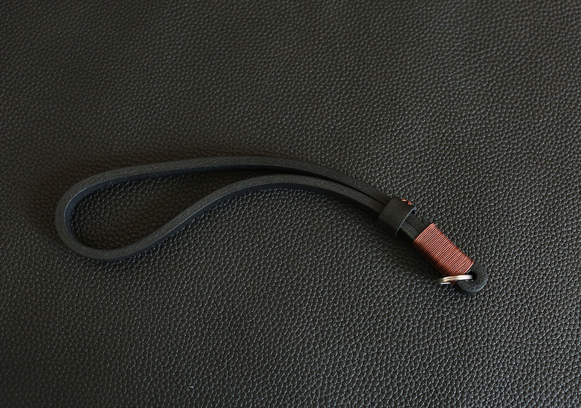 Rugged 11mm wide leather camera wrist loop providing superior gear support