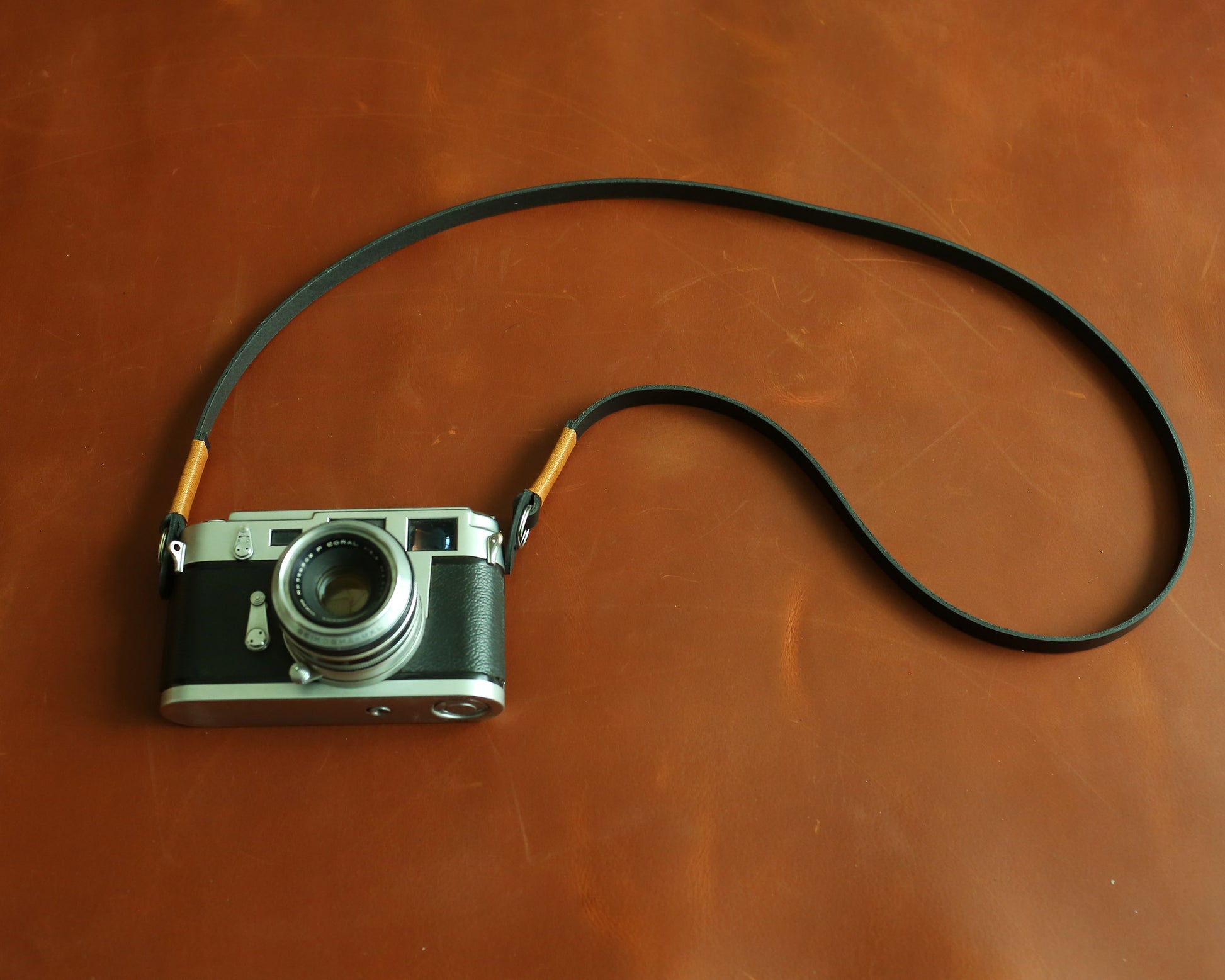 Stealth black artisan camera carrier with a 10mm low-profile design