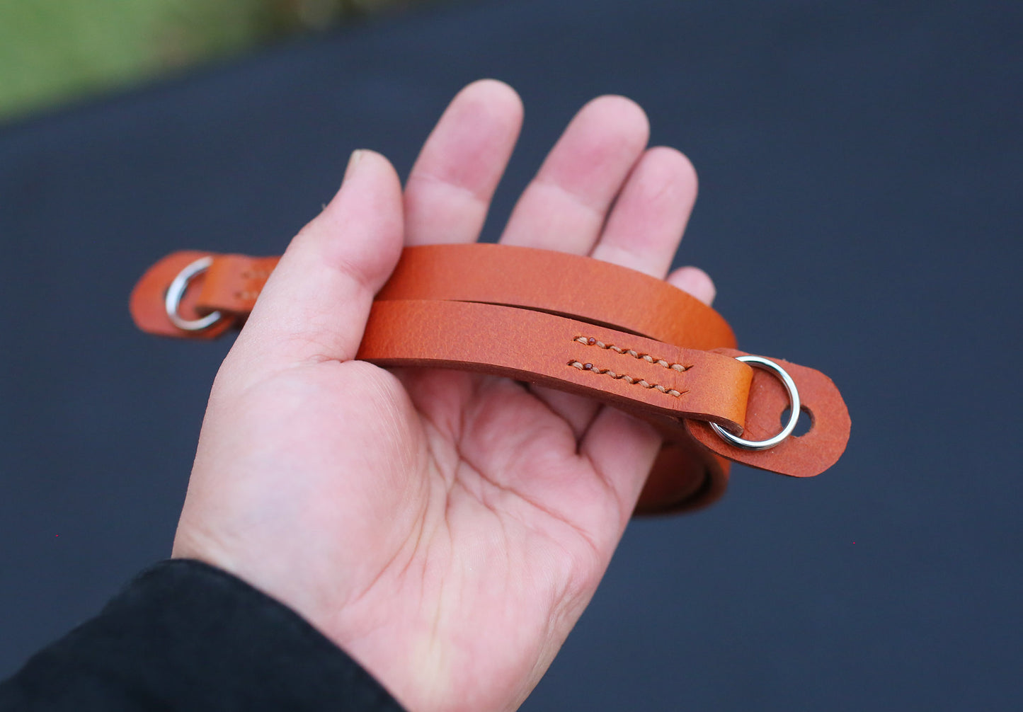 Khaki wax-thread stitching close-up