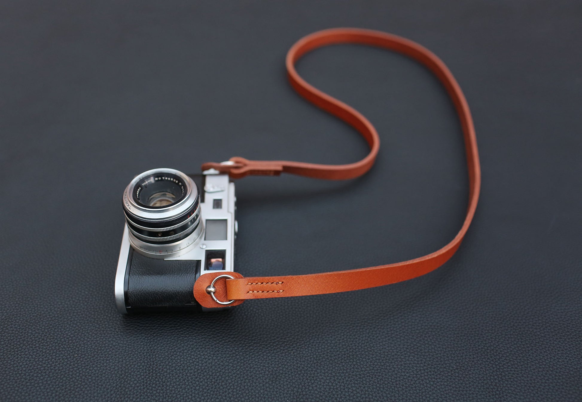 Full-grain veg-tan leather strap detail