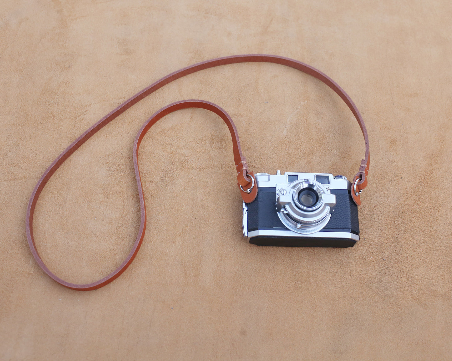 Durable vegetable-tanned leather strap in rich saddle brown color