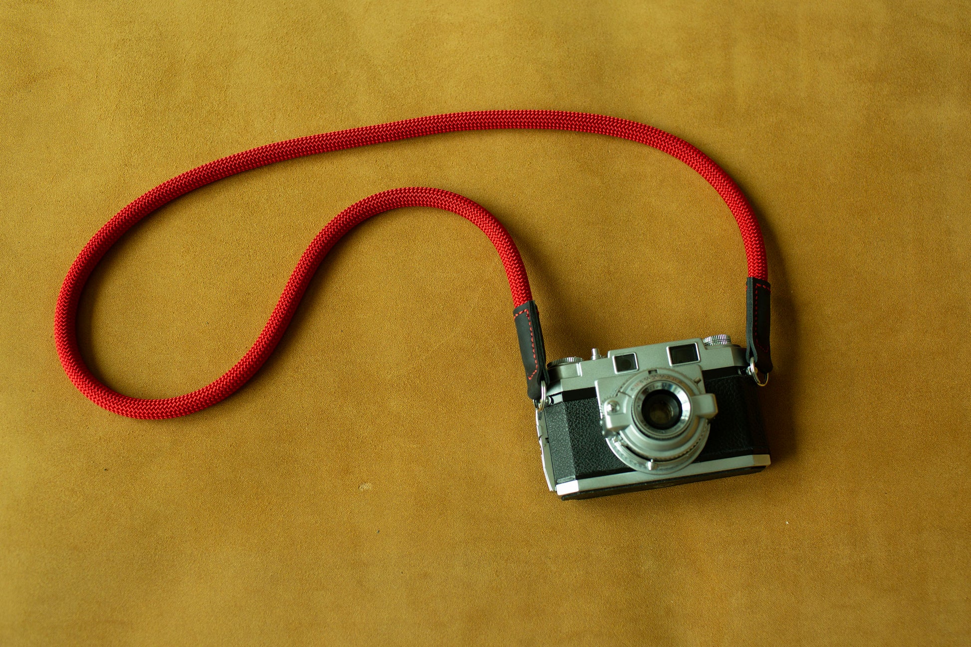 Vintage style red rope camera strap compatible with DSLR and mirrorless cameras