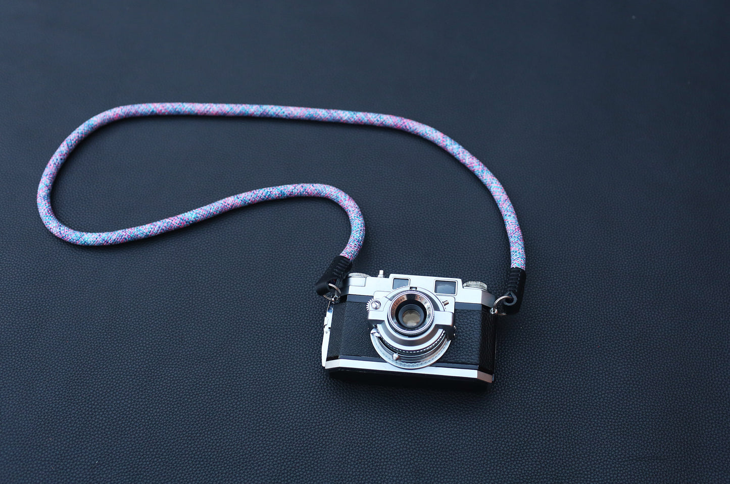 Violet elastic camera strap with hand-finished leather ends