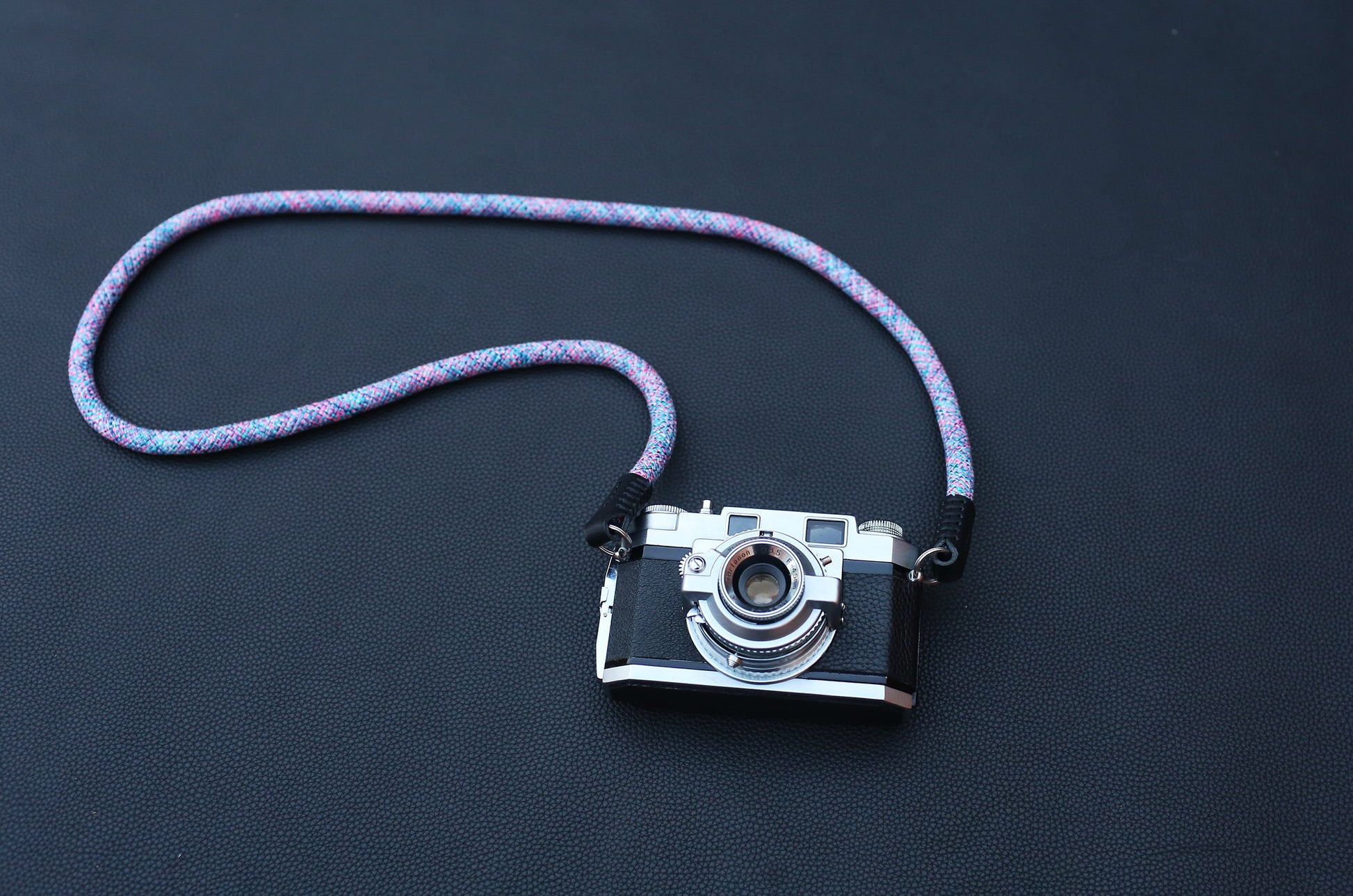 Violet elastic camera strap with hand-finished leather ends