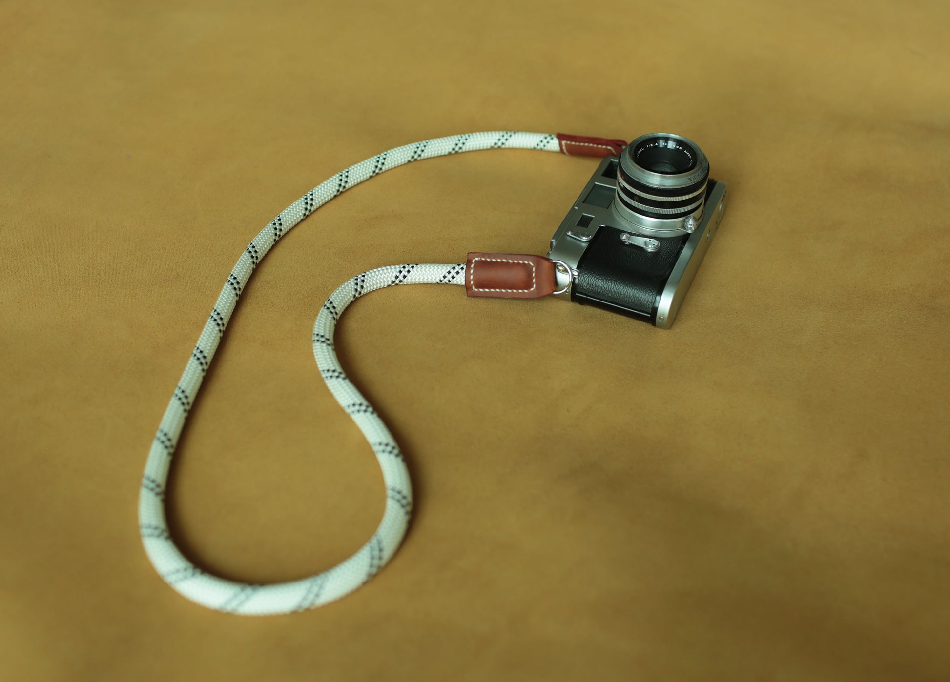 Handmade white climbing rope camera strap with brown leather ends