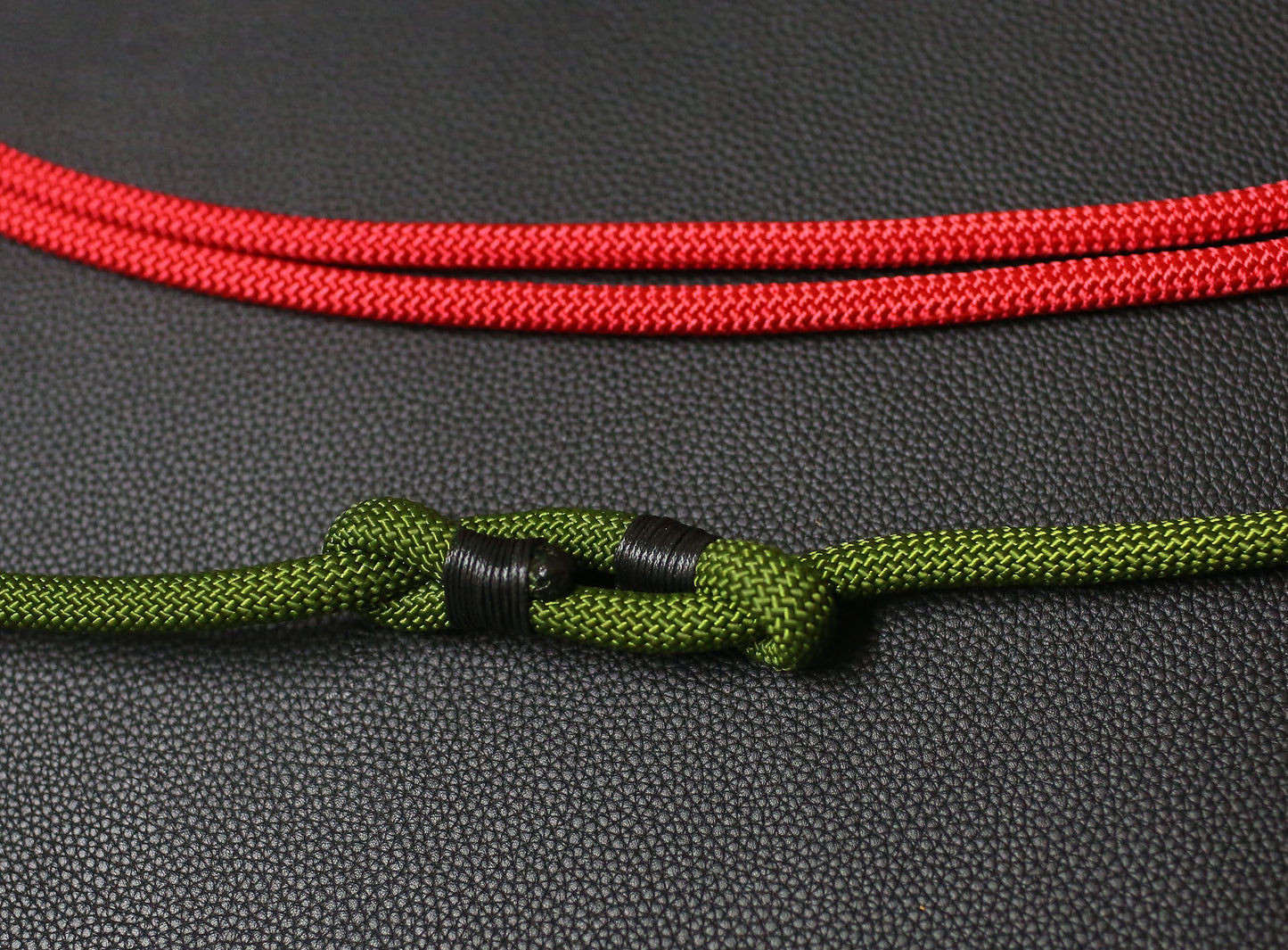 Close-up view of Windmup adjustable rope camera strap showing knot detail