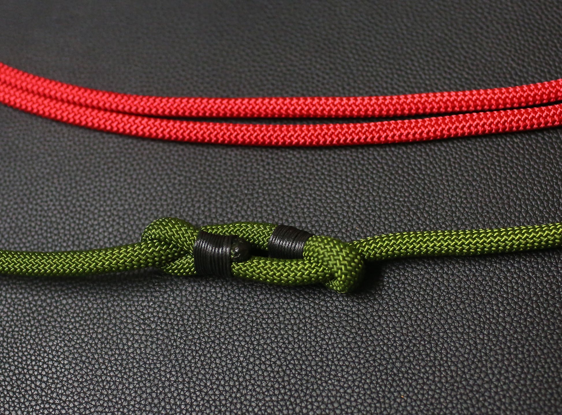 Close-up view of Windmup adjustable rope camera strap showing knot detail