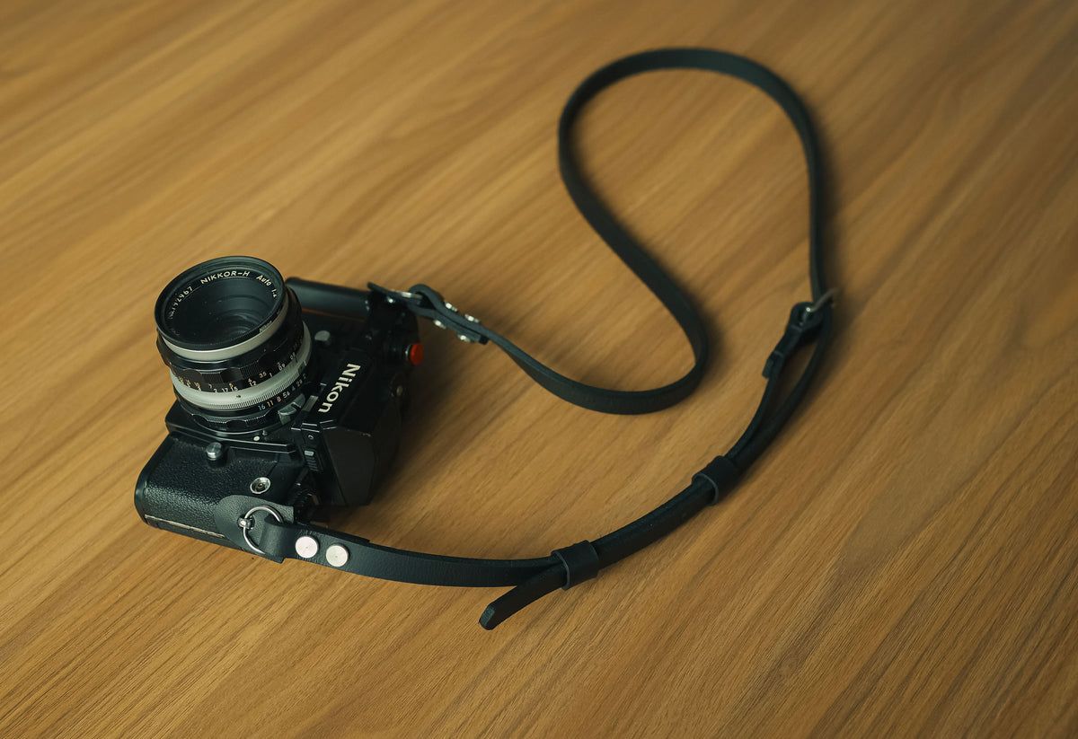 Handmade adjustable black leather camera strap with vintage camera