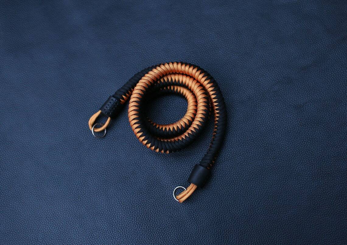 camera strap on dark background