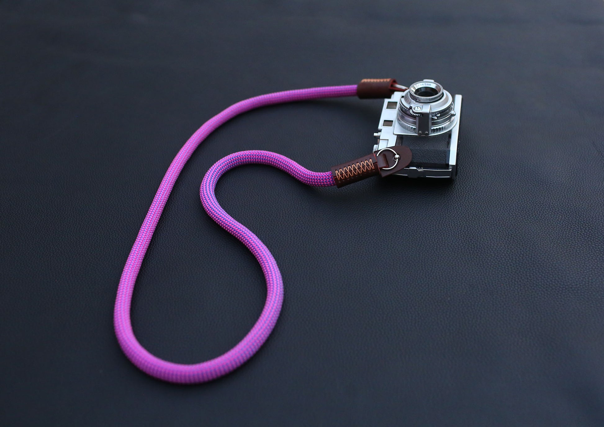 purple climbing rope camera strap with brown leather ends