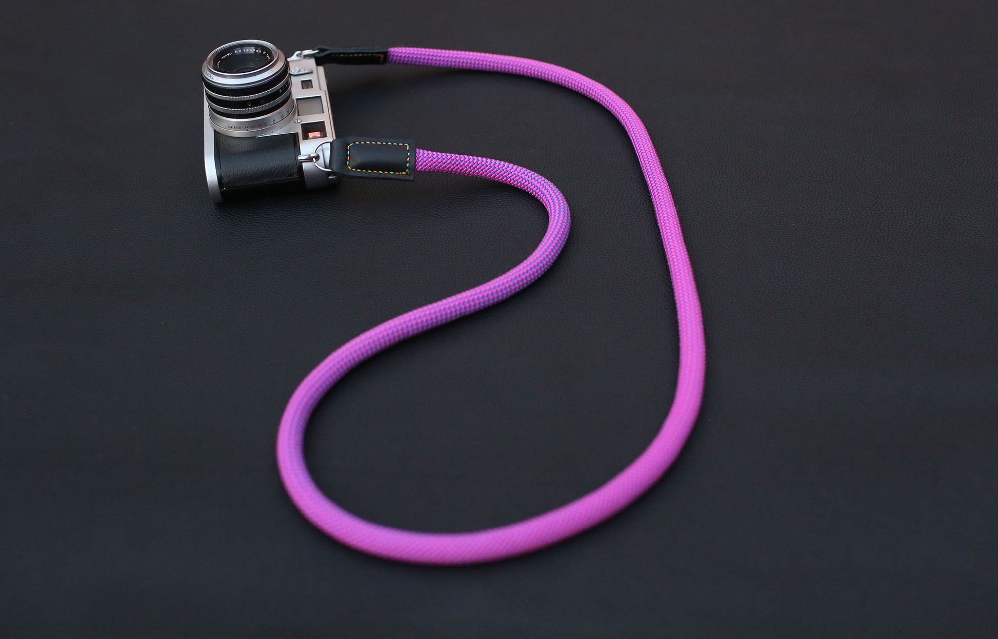 close-up of multicolor stitched leather connector