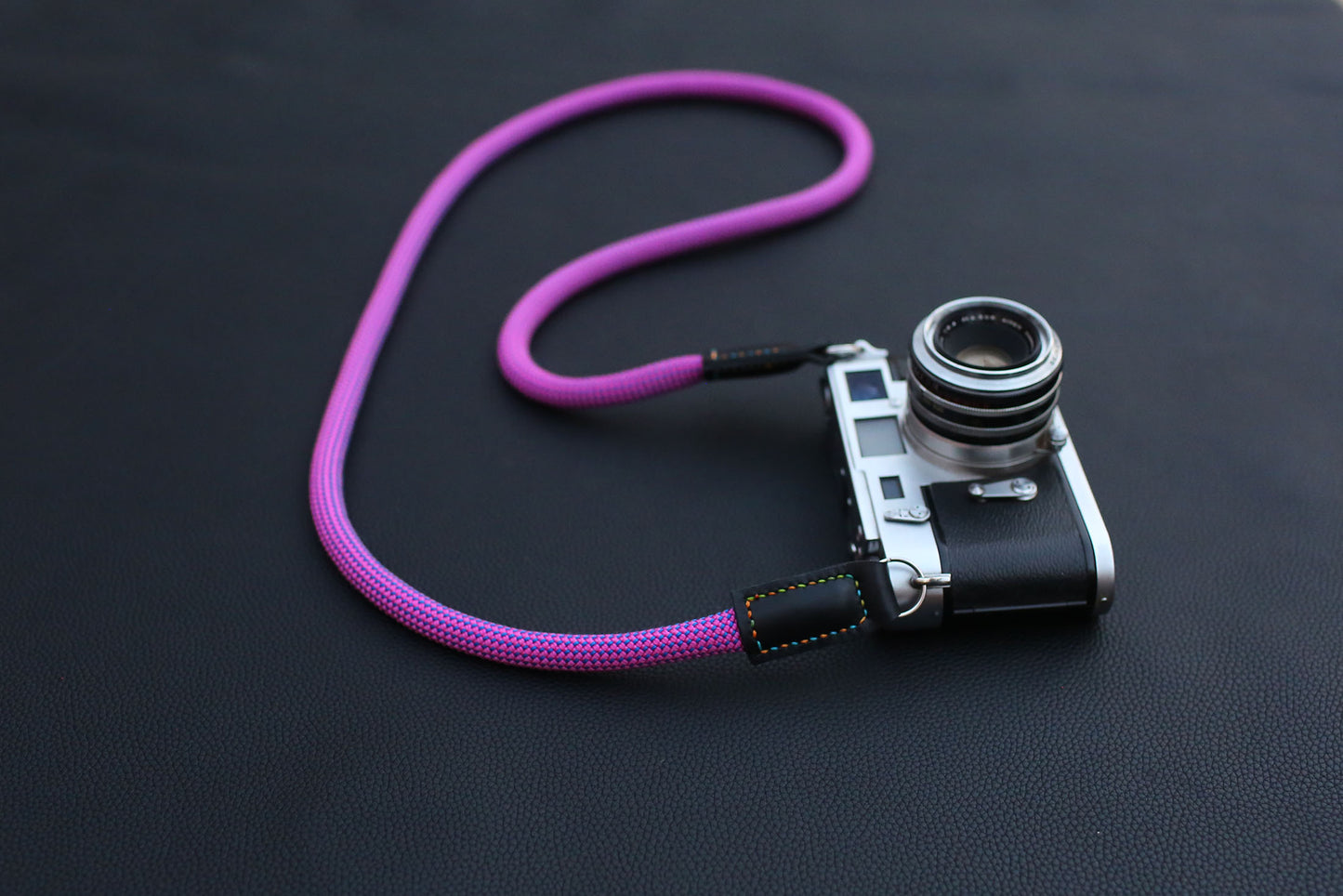 coiled purple rope strap on dark background
