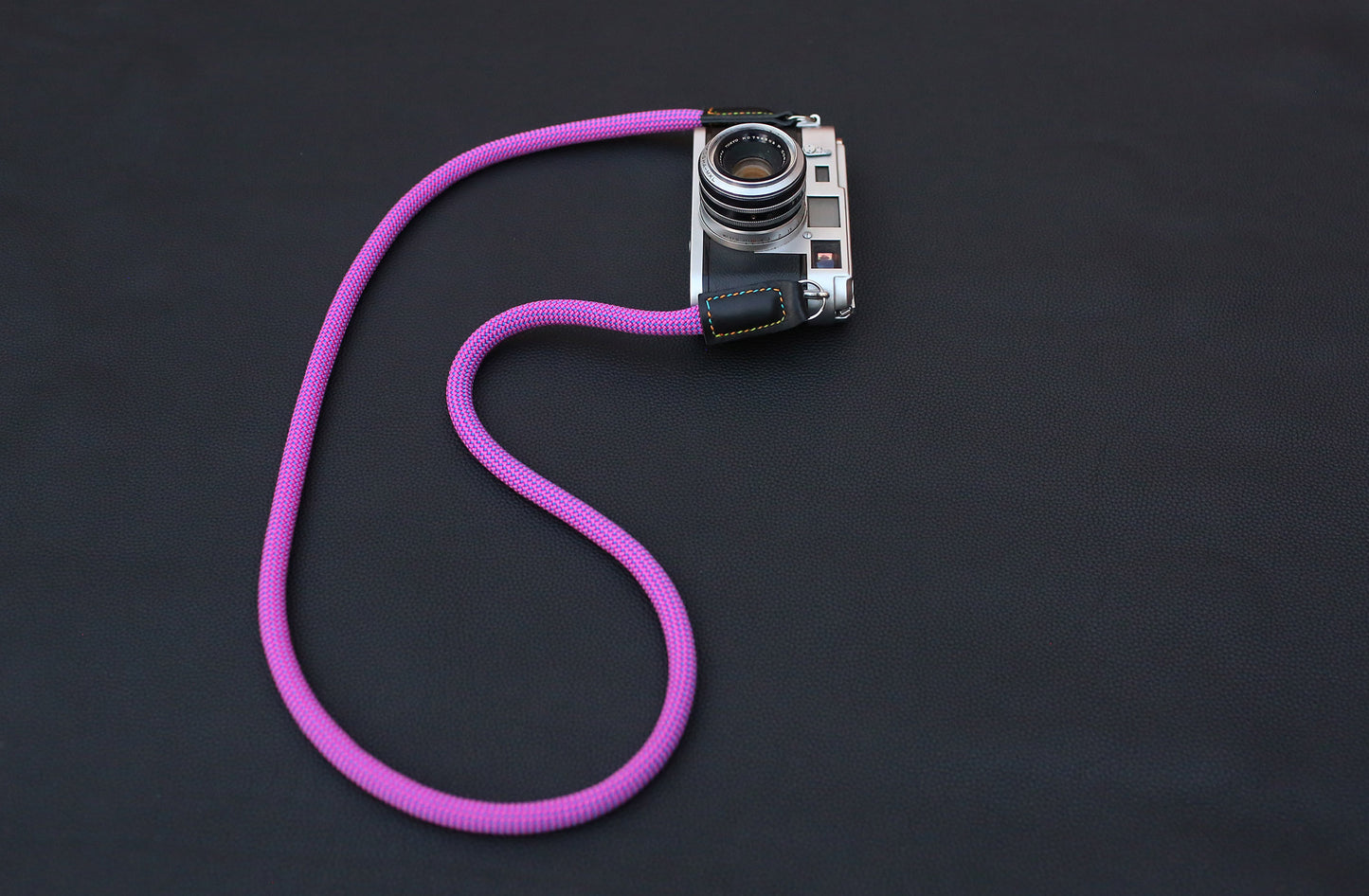 purple rope strap displayed with vintage camera