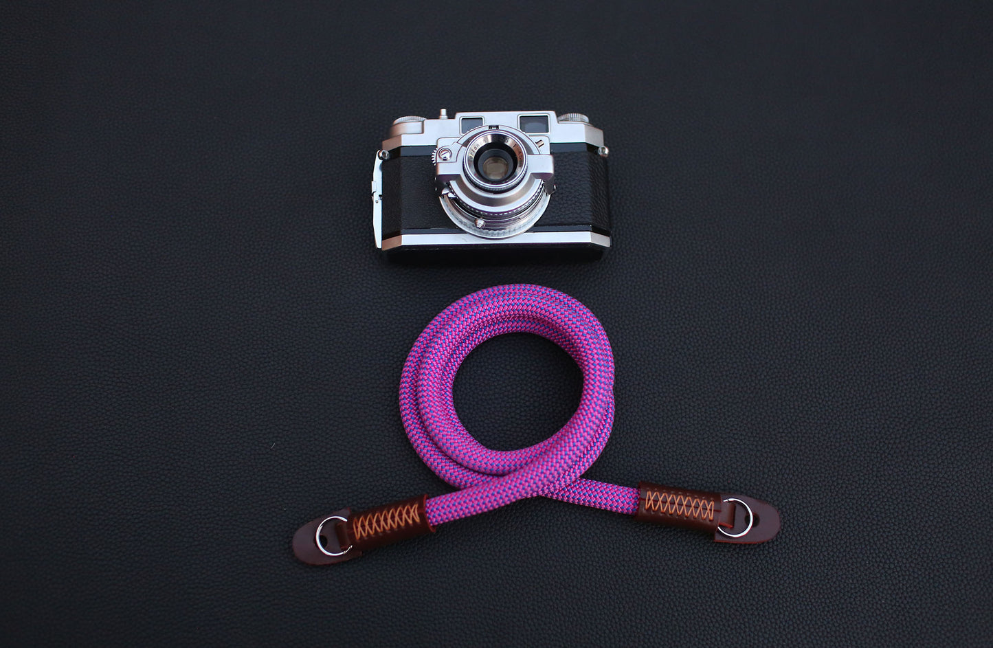 full-grain brown leather with wax stitching