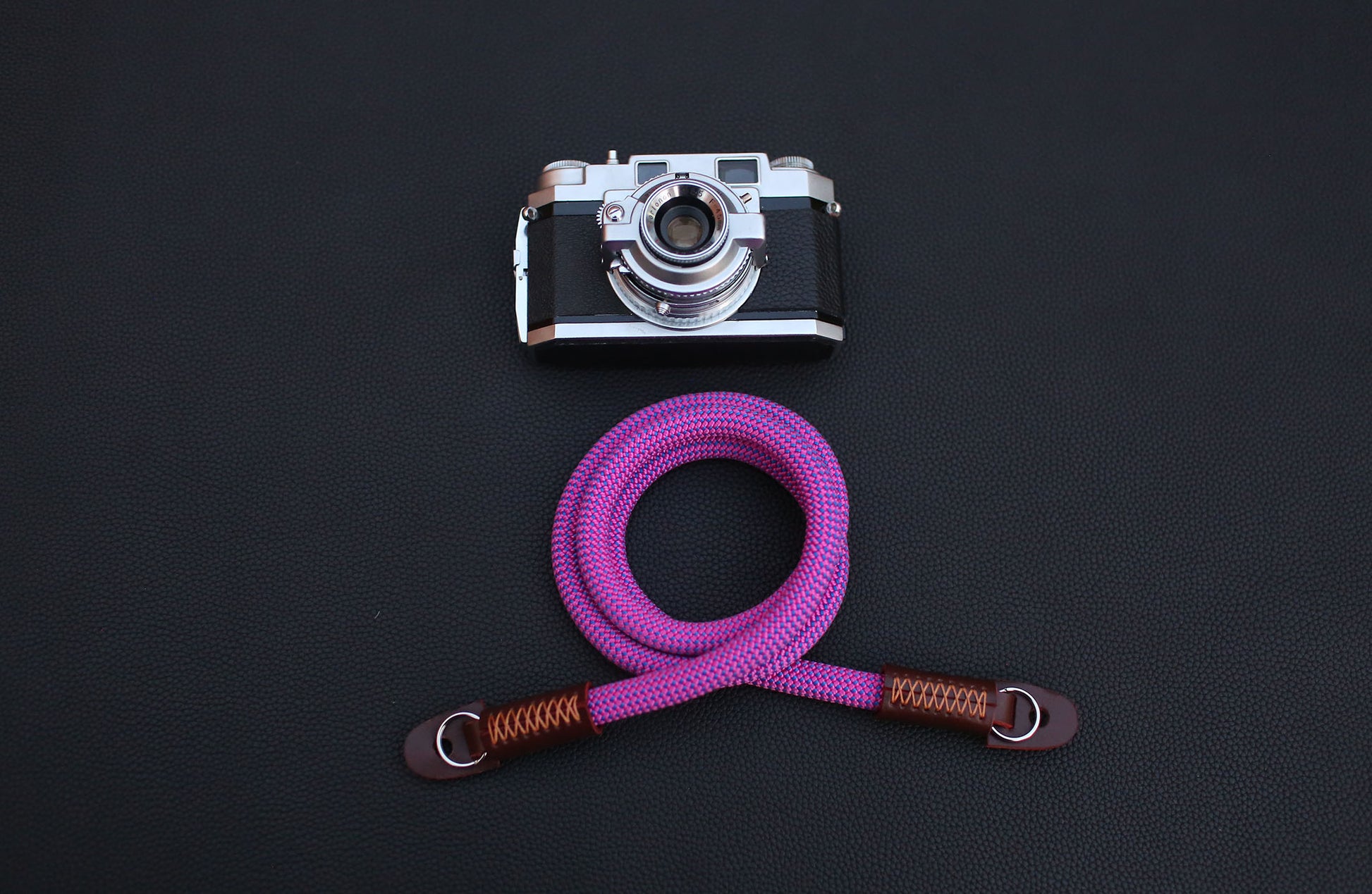 full-grain brown leather with wax stitching