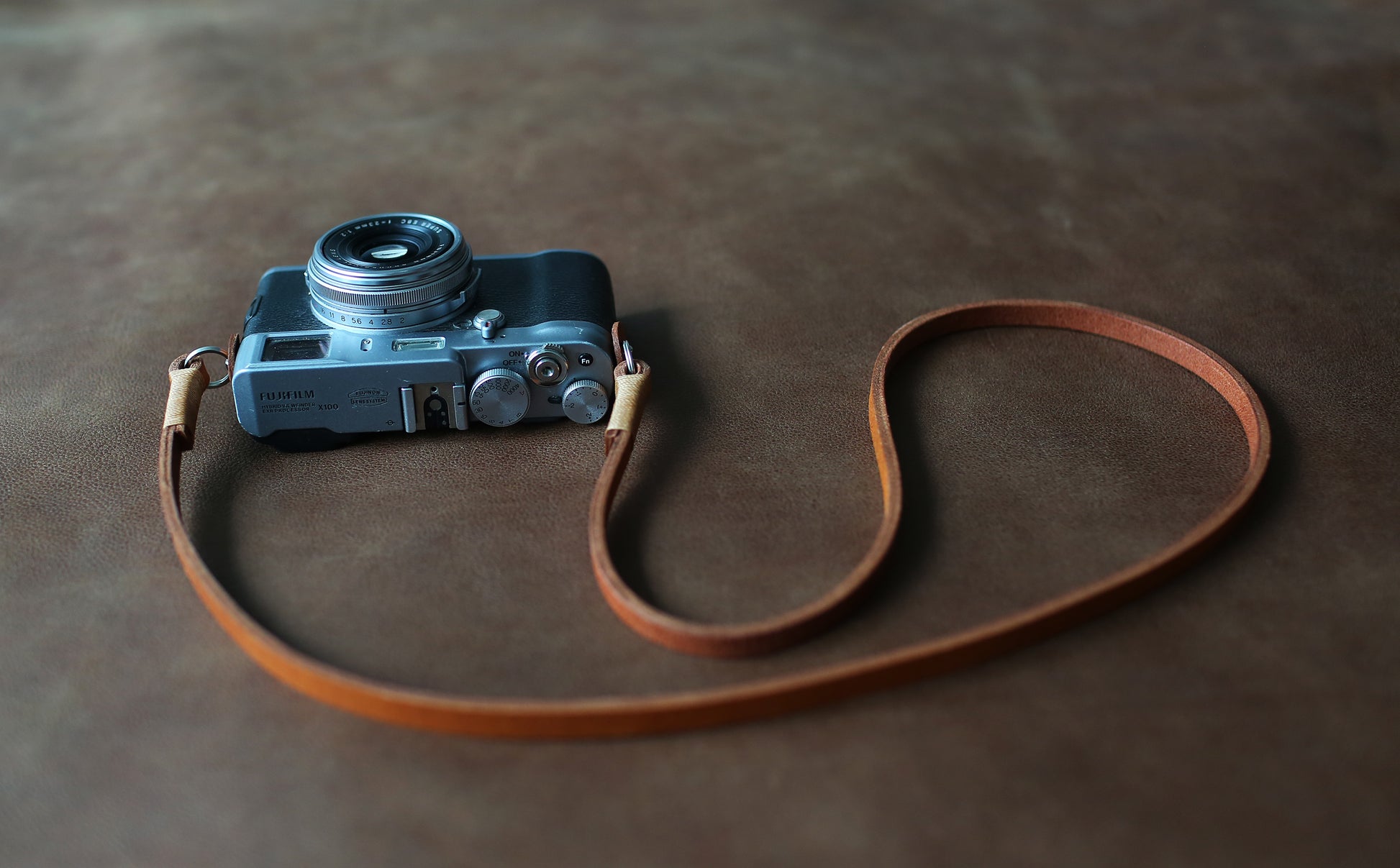 Durable 8mm leather camera strap with beige waxed thread detailing